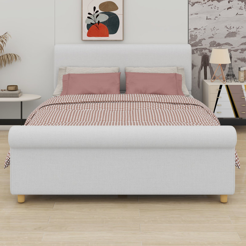 Platform bed frame with classic sleigh silhouette and high headboard anchors traditional bedrooms, Queen