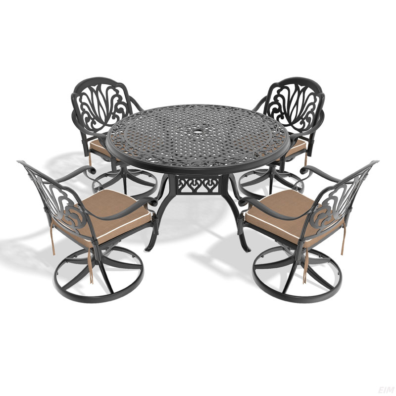 L'ensemble de salle à manger en fonte d'aluminium toutes saisons comprend des chaises pivotantes et une table avec un cadre noir