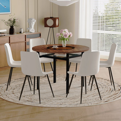 Ensemble table et chaises Ensemble de table de salle à manger ronde moderne minimaliste brun grain de bois de 42 pouces, jumelé à 6 chaises en polyuréthane artificielles blanches avec coussins arrondis. Convient pour les salles à manger, les bureaux, etc.