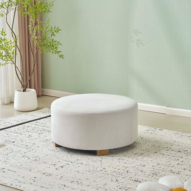 Repose-pieds rond avec pieds en bois et conception simple