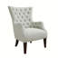 Fauteuil à oreilles capitonné