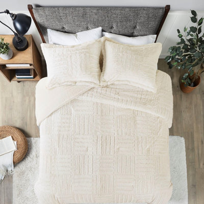 Édredon en fausse fourrure de style damier pour un lit de repos double