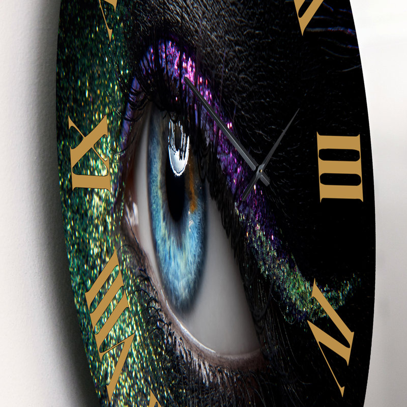 Horloge murale moderne avec yeux féminins et pigments verts et mauves, Petit