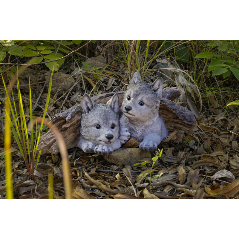 Grey Wolf Cubs Hiding Under Log Statue