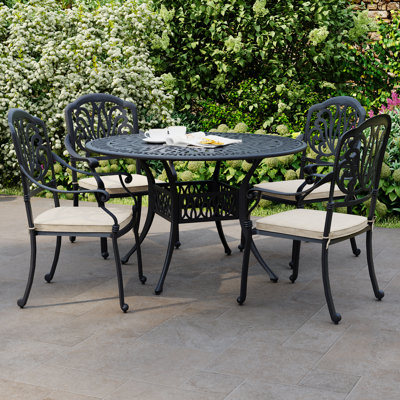 Chetek 4 - Person Patio Dining Set with Round Table , Cushions Included