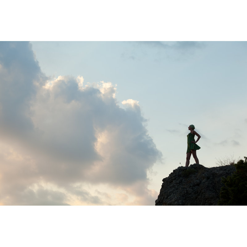 Woman Standing On Rock by Tomch - Wrapped Canvas Print, 30cm H x 46cm W