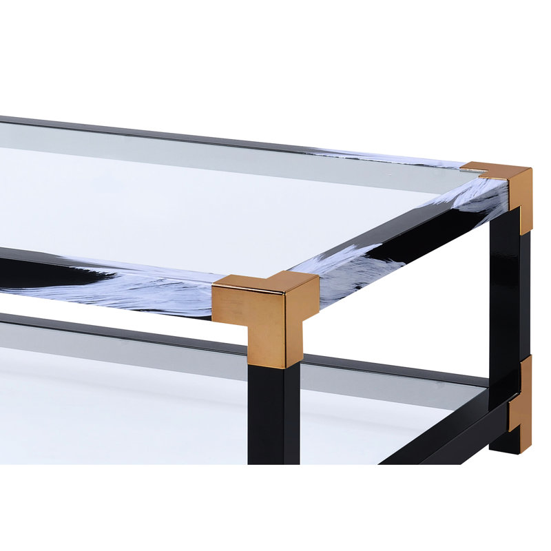 Table basse moderne avec pieds en métal et surface en verre transparent