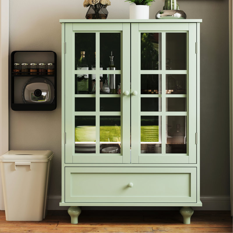 Buffet de cuisine contemporain avec portes et tiroir en verre double - menthe. Qualité fine, robustesse des pieds en bois massif, protection trempée. Tablette réglable, espace pratique.