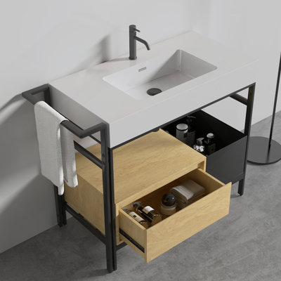 Meuble-lavabo modulaire de 36 po de style industriel. Ce meuble-lavabo est doté d'une structure en métal robuste rehaussée d'éléments en bois chaleureux et est surmonté d'un bassin en pierre artificielle sans couture et facile à nettoyer. KD