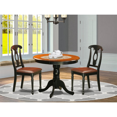3 Piece Dining Room Table Set Contains a Round Kitchen Table with Pedestal and 2 Faux Leather Upholstered Dining Chairs, Black & Cherry