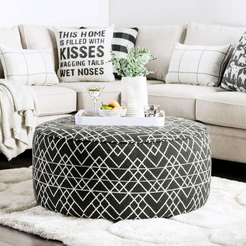 Repose-pieds rond rembourré de style contemporain avec bordure noire