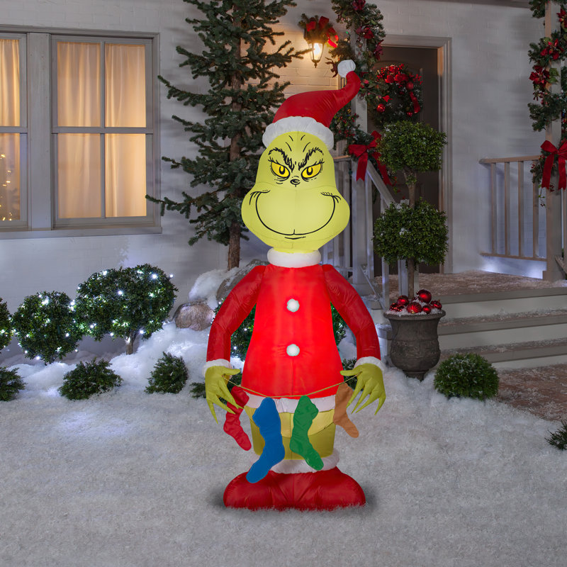 Airblown Grinch Holding String Of Stockings Inflatable