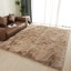Tapis beige en fausse peau de mouton à poils longs Malaiah