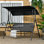 Balancelle d'extérieur 3 places avec coussin amovible, support en acier et auvent inclinable pour patio, jardin, piscine, balcon, cour, noir 1