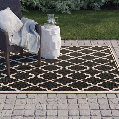 Tapis intérieur / extérieur à motif géométrique noir / sable Broddrick
