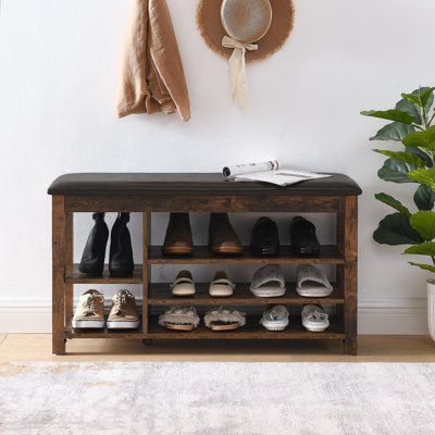 Un long banc à langer réglable en hauteur, fabriqué en bois d'hévéa naturel, est livré avec un siège confortable, un espace de rangement dissimulé et de grands compartiments de rangement, en bois grainé gris anthracite, rétro