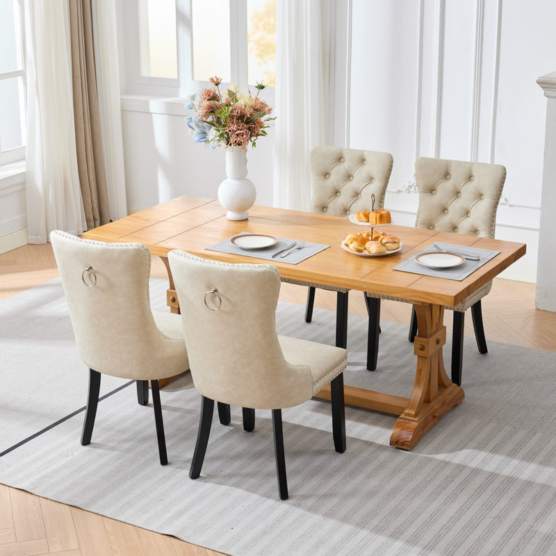 Ensemble de 4 chaises de salle à manger, style vintage, en similicuir imitation peau de mouton, dossier haut, capitonnage à boutons et clous décoratifs, coussin à ressorts ensachés et structure en bois.