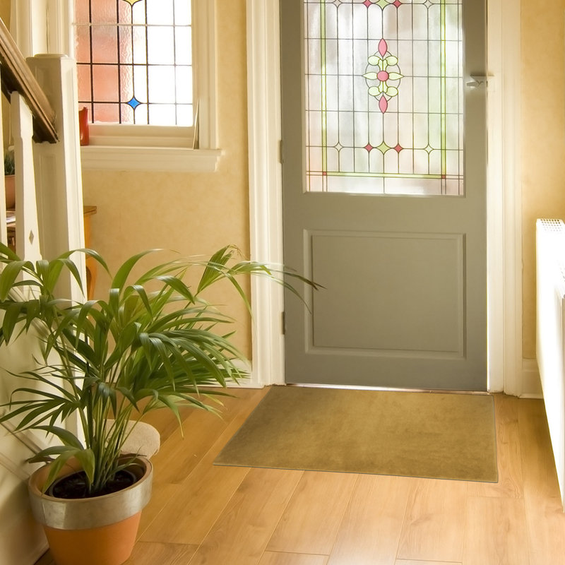Spiceland Floral Polypropylene Area Rug in Solid Beige