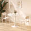 Table ronde blanche avec piètement en acier massif pour un usage quotidien dans un salon moderne et stable