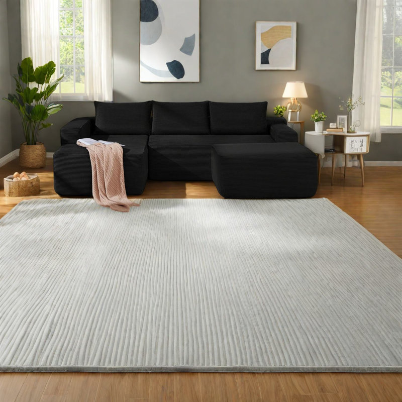 Canapé modulaire luxueux en velours côtelé noir, design moderne pour espaces de vie
