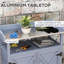 Table de rempotage grise avec rangement. Fabrication en bois. Plateau en aluminium. Roues en caoutchouc pour la mobilité. Rouille. Pour le jardinage de patio. Banc l 34,4 po x P 16,5 po. Compartiment de rangement. Surface de travail. Lisse