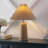 Anirudh 20.5" Rustic Scandinavian Resin/Iron Lighthouse LED Table Lamp with Pleated Shade