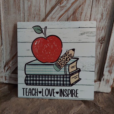 Enseigne «Teach Love Inspire»
