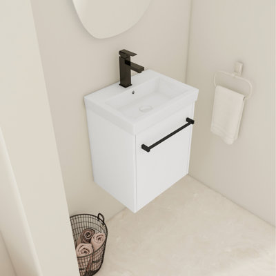 Meuble-lavabo avec lavabo en céramique. Charnières à fermeture en douceur pour une ouverture silencieuse. Petits espaces de décoration de salle de bain moderne. Comptoir d'évier en contreplaqué. Fonction de fixation flottante. Conception de salles de bain. Unité de base