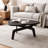 31.7" Triangular Sculptural Coffee Table with Curved X-Base, Dark Wood Finish