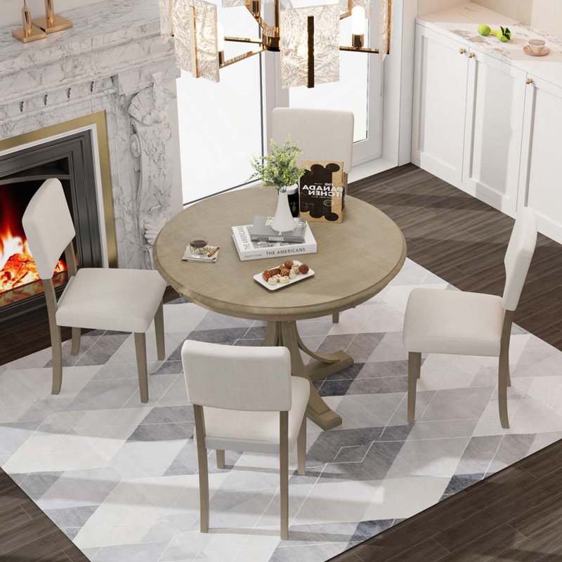 Round Dining Table Set with Curved Trestle Style Table Legs and 4 Upholstered Chairs