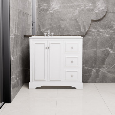 Meuble-lavabo blanc transitionnel de 36 pouces avec lavabo en céramique, 2 portes à fermeture en douceur, une tablette réglable en forme de U, 3 tiroirs (dont un avec cloison), finition peinte, beaucoup de rangement.