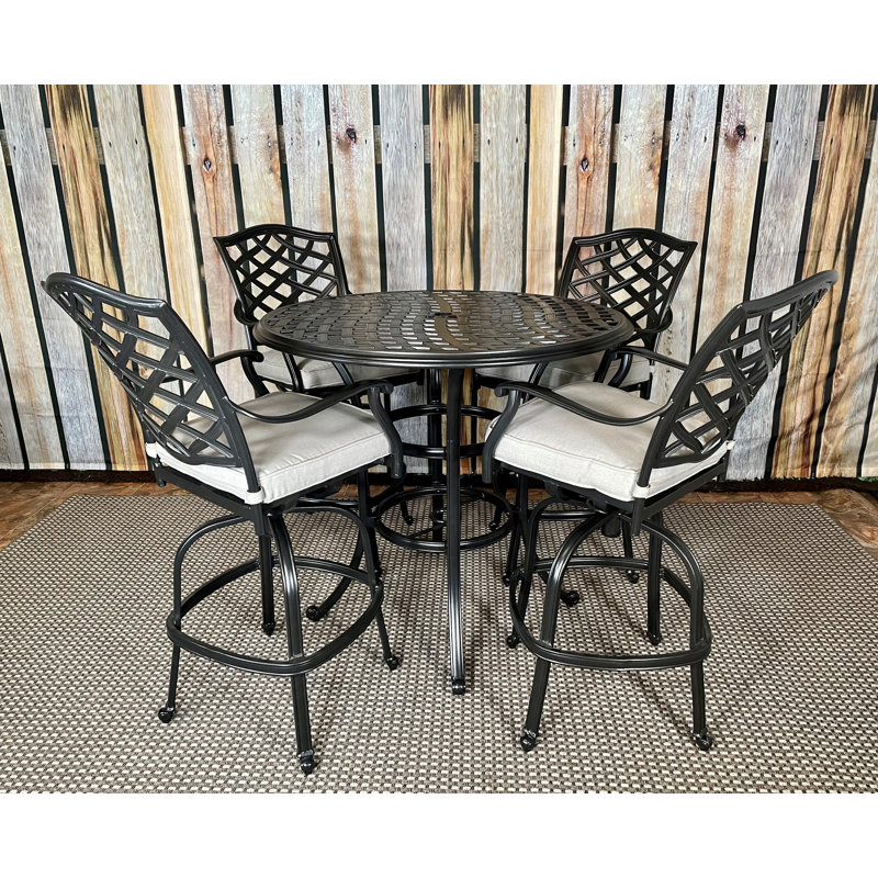 Humza 4 - Person Patio Dining Set with Round Table , Cushions Included