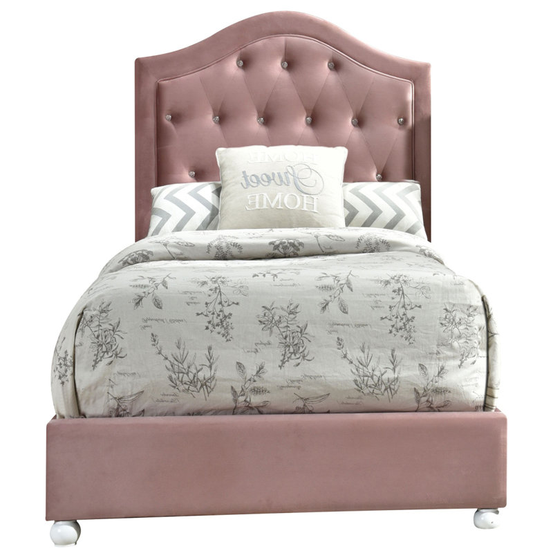Lit tapissier rose capitonné