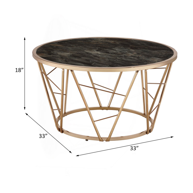 Table basse avec plateau en verre et finition champagne