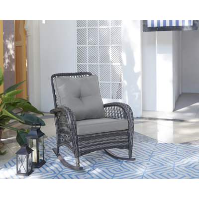 Chaise berçante de patio avec coussins en polyester Fruttuo