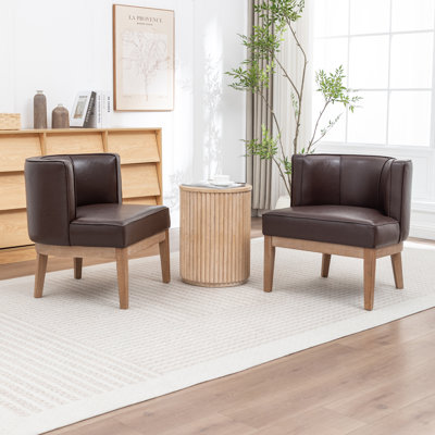 Fauteuil demi-tonneau rembourré Ezra