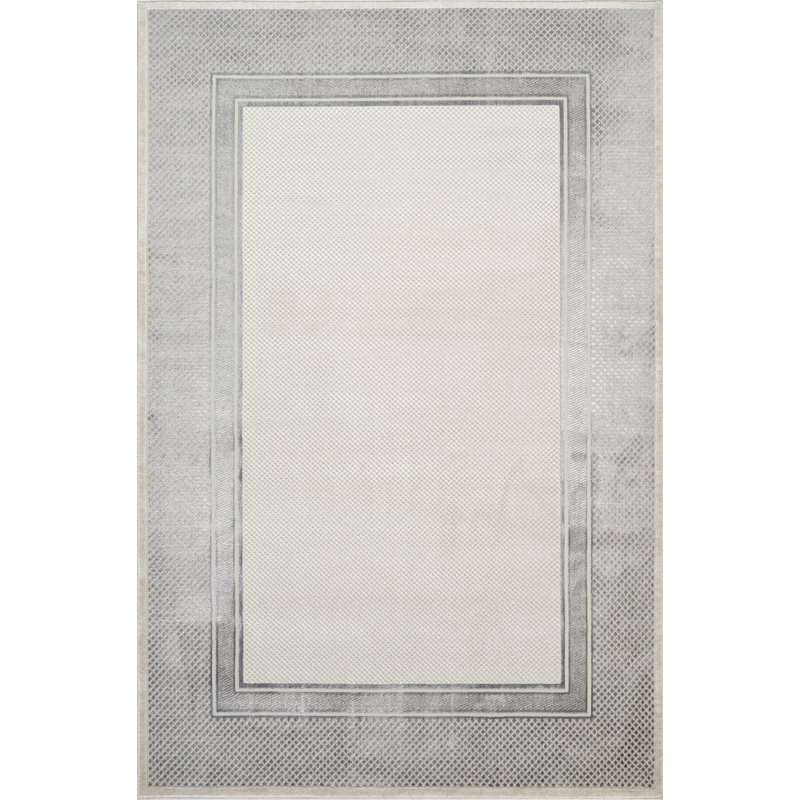 Tapis gris / crème à motif géométrique de la collection Omari