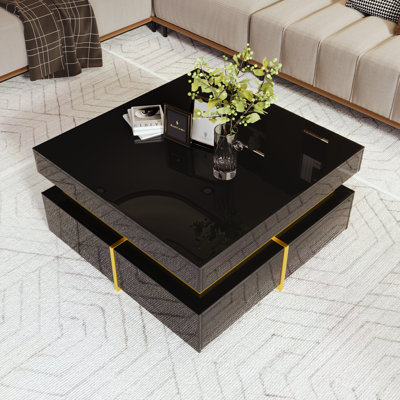 Table basse Velmont Glam avec tiroirs et accents dorés, finition ultrabrillante et design durable