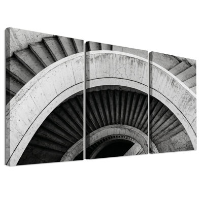 Ensemble de 3 toiles murales représentant un escalier en colimaçon en béton noir et blanc