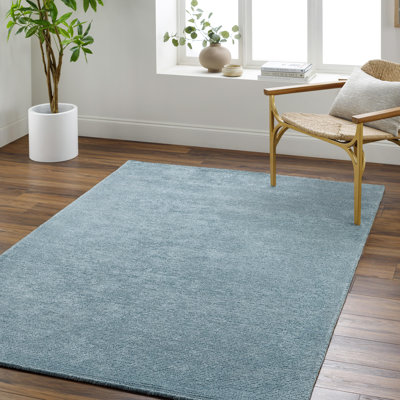 Tapis en viscose / laine touffeté à la main de couleur turquoise Dishaun
