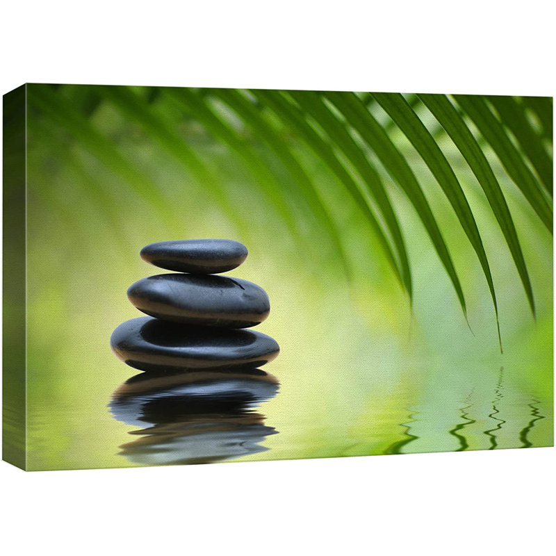 «Green Bamboo Leaves over Zen Stones Pyramid Reflecting in Water Surface», reproduction de photo sur toile tendue