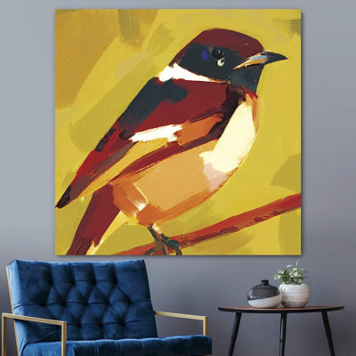 Mignon chardonneret brun, rouge et orange perché sur une branche sur fond jaune sur toile