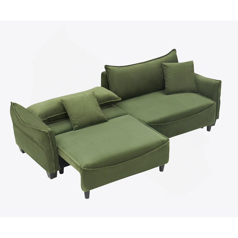 Tissu en velours côtelé vert, ce canapé peut être converti en canapé-lit avec deux coussins décoratifs