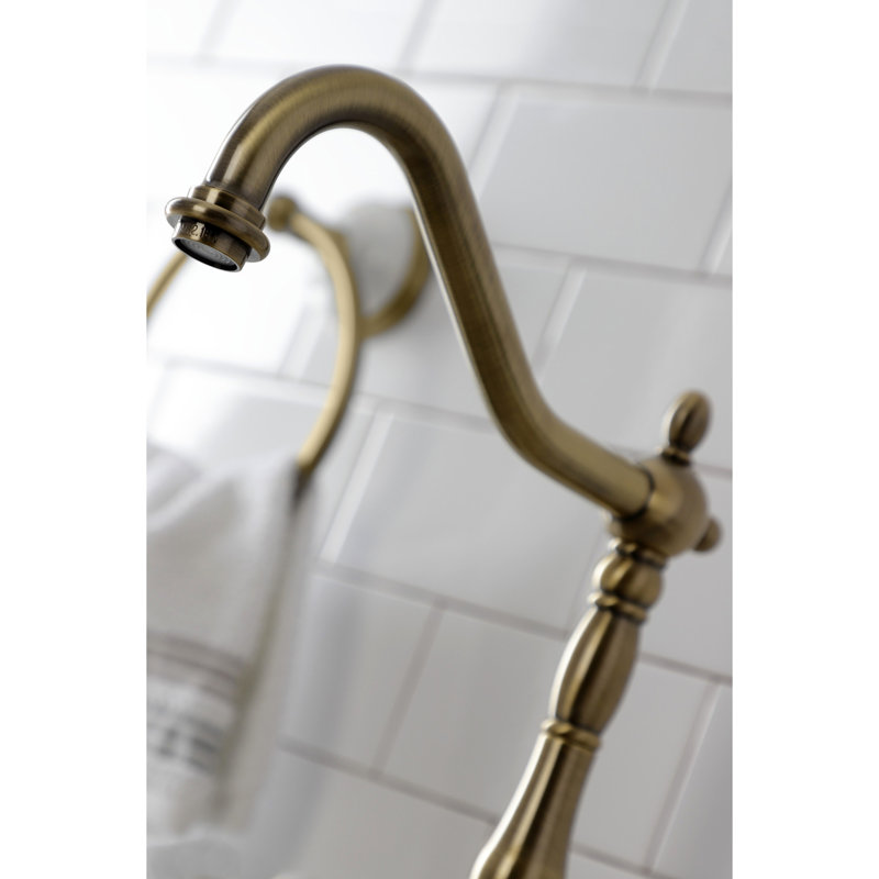 Kingston Brass Tudor Two-Handle 3-Hole Deck Mount Bridge Kitchen Faucet with Brass Side Sprayer, Antique Brass