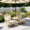 Banc d'extérieur à roulettes 2 places avec table centrale, banc de jardin en bois naturel avec trou pour parasol et dossier haut