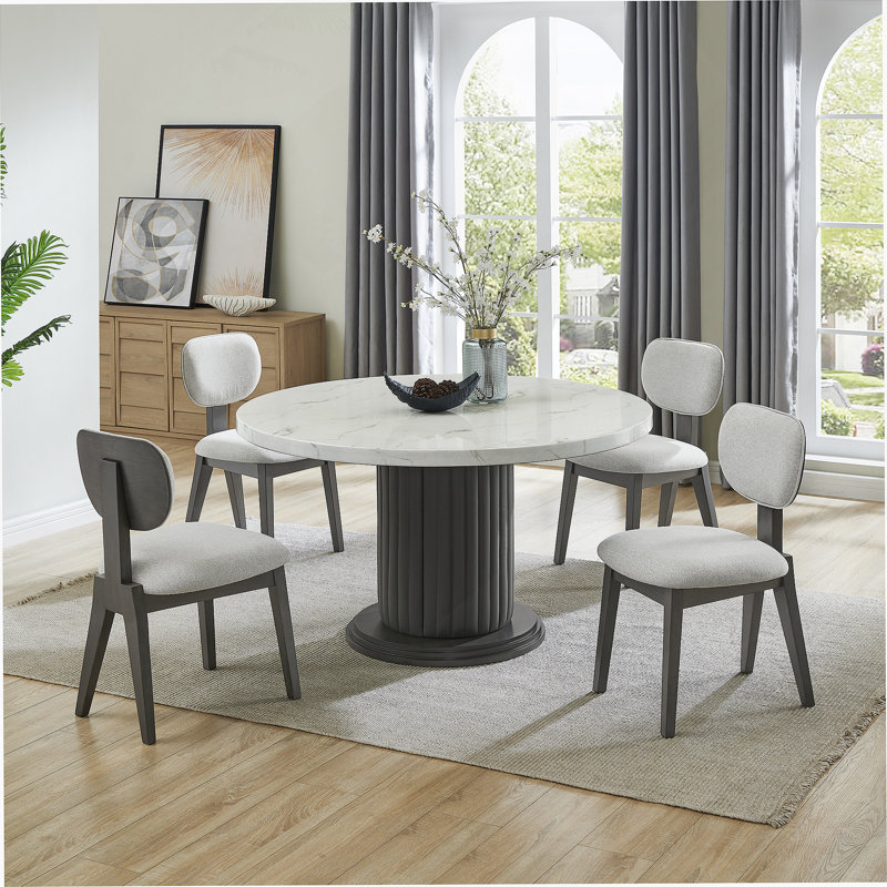 Ensemble de salle à manger 5 pièces rond en faux marbre avec chaises rembourrées et base piédestal pour les espaces de salle à manger modernes.