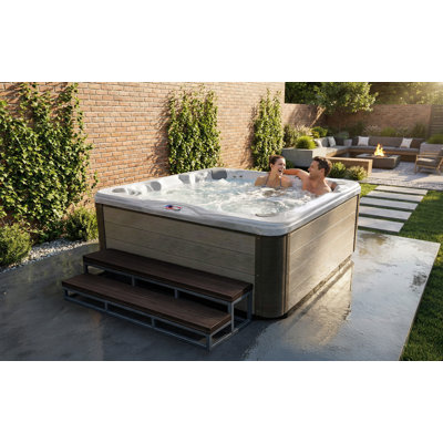American Spas 7-Person 56-Jet Premium Bench Spa Standard Hot Tub With Sound System And LED Waterfall
