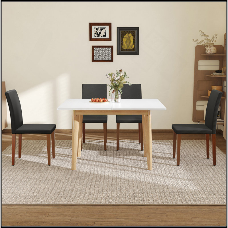Ensemble de table et de chaises. Plateau de table en pierre frittée blanche, pieds en bois d'hévéa, bureau d'ordinateur pliable, bureau pliable. Comprend 4 chaises de salle à manger en polyuréthane noir avec pieds en métal de couleur noyer.