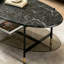 Ensemble de tables basses gigognes noires, modernes et minimalistes, avec plateaux ronds et ovales