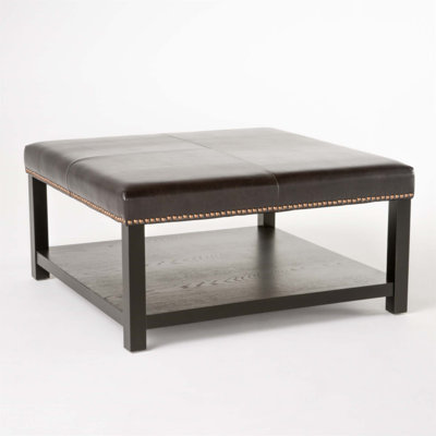 Versatile Ottoman Coffee Table with Padded Top and Hidden Storage, Perfect for Living Rooms and Entertainment Areas.